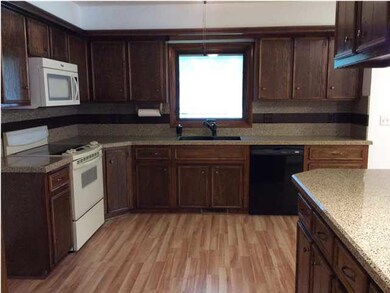 Updated kitchen with new granite counters, backspl