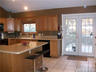 Kitchen Kitchen with french doors lead to concrete
