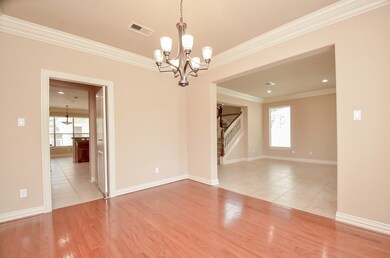 Elegant dining room featuring beautiful wood floor