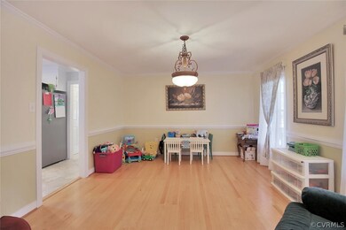 Formal Dining Room has hardwood floors, crown mold