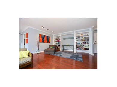 Living Room. Double floor to ceiling bookcases fla