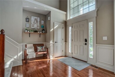 Enter from the soaring front porch into the two-st