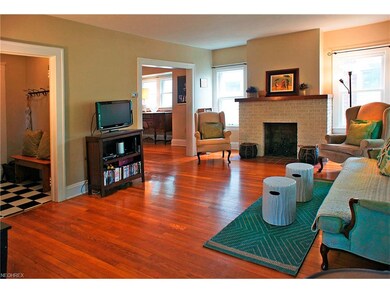View from foyer, to dining room and side door hallway and half bath.