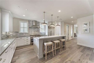 Kitchen center island topped with carrara marble