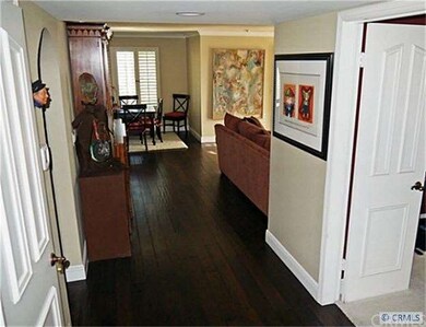 Newer Hardwood floors lead to the living room, din