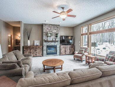 Floor to ceiling windows and stunning stone firepl