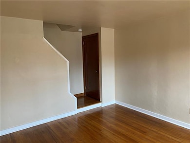LIVING ROOM TO COAT CLOSET AND STEPS TO THE SECOND FLOOR.