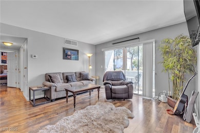 Living area featuring Laminate wood finished floor