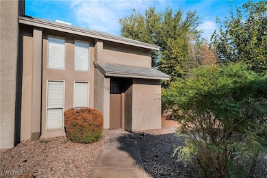 Property entrance with stucco siding