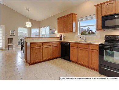 Spacious kitchen with bar to dining area