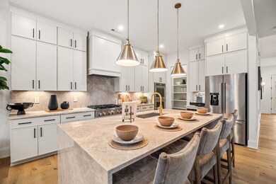 Options shown in the Gourmet Kitchen include: cabinetry to the ceiling, waterfall island, upgraded appliances, upgraded backsplash and pendant lighting. Toll Brothers is known for offering Unrivaled Choices and this kitchen showcases that!