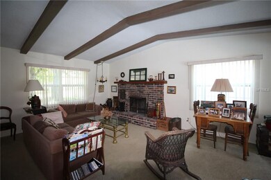 Vaulted wood beamed ceilings & brick fireplace