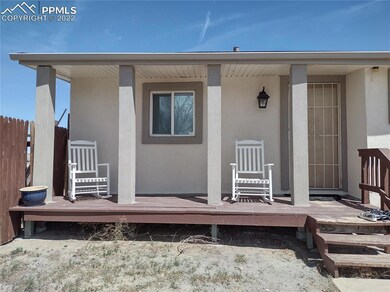 Adorable side porch with entry into the kitchen