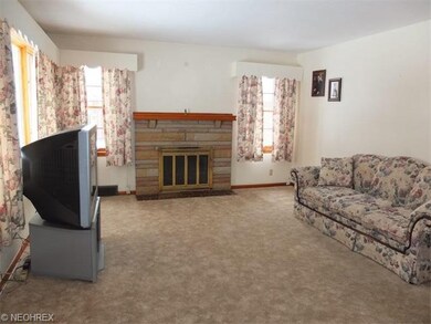 Another view of the living room with fireplace.