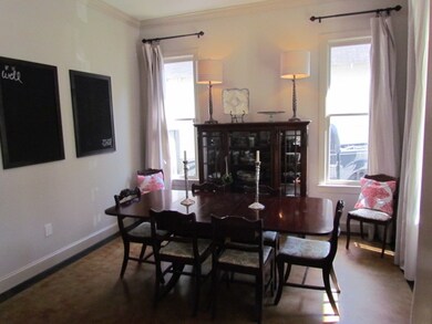 The room offers neutral paint color, custom draper