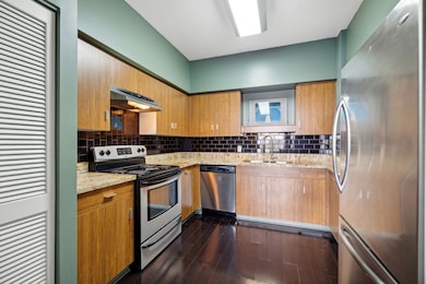 Kitchen with granite counters, stainless appliance