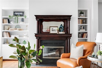 Sitting room with hardwood / wood-style floors and