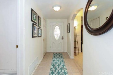 Entry hall with beautiful tile throughout the main