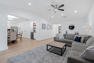 Living area featuring beverage cooler, lofted cei