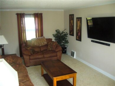 Large living room, decorative fireplace, crown mol