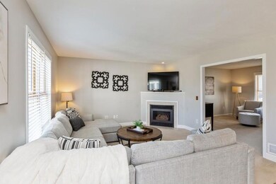 Light and bright main floor family room with cozy gas fireplace.
