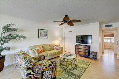 ANGLED VIEW OF LIVING ROOM AND HALLWAY