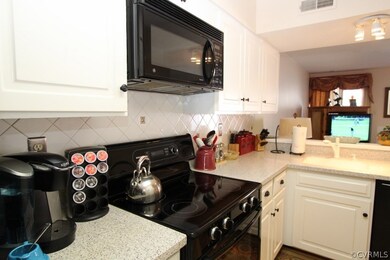 Corian Courntertops and tile backsplash.