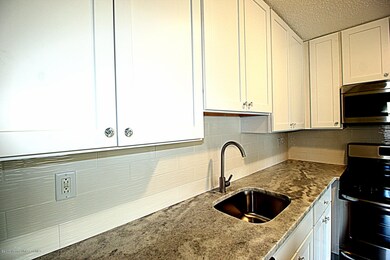 Granite countertops and tiled backsplash