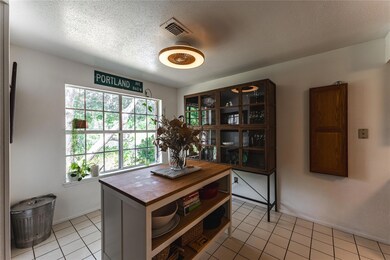 Office area with light tile patterned floors and 
