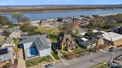 Aerial view of a large body of water and a notable bridge