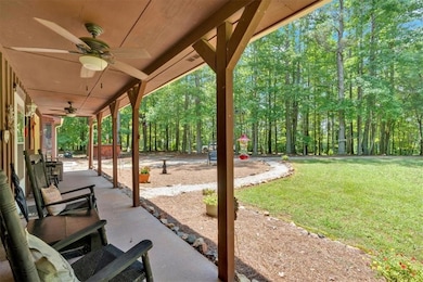 View of patio featuring a ceiling fan