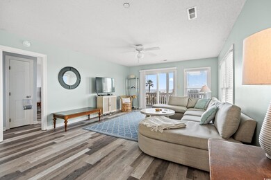 Living room with ceiling fan, wood-type flooring, 