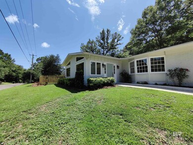 Single story home with lots of yard space on this corner lot