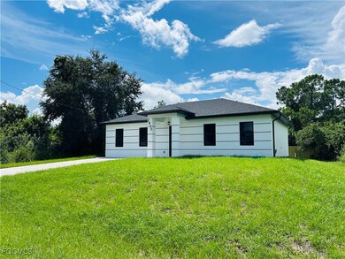 View of front of property with a front lawn