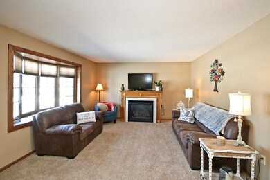 Living room with gas burning fireplace.