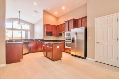 Spacious Kitchen with Solid Wood Cabinets and Ston