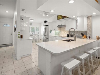 Kitchen featuring stainless steel fridge with ice 