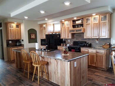 Brand new...with beautiful Hickory cabinets and bl