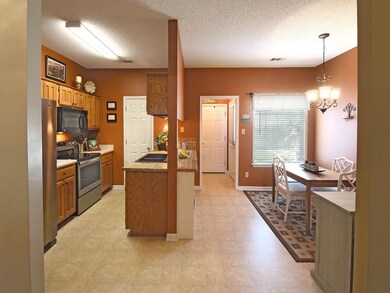 The kitchen and dining breakfast areas are open to