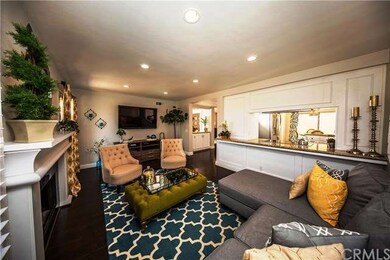 This family den host a custom fireplace mantle and