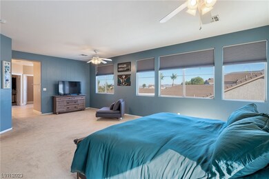This grand primary suite, nestled upstairs, boasts