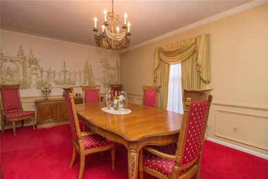 An elegant 16X12 dining room boasts judges panelin