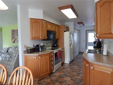 Kitchen view shows Back entrance door and Laundry 