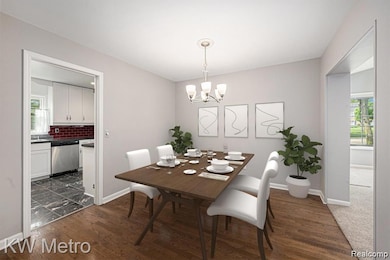 Dining area with dark wood-type flooring and a chandelier