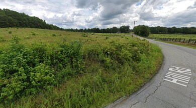 View of asphalt road with a view of countryside