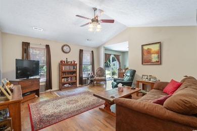 Living room with light hardwood / wood-style floor