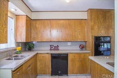 Nice kitchen with matching black appliances and that clean look of the granite.