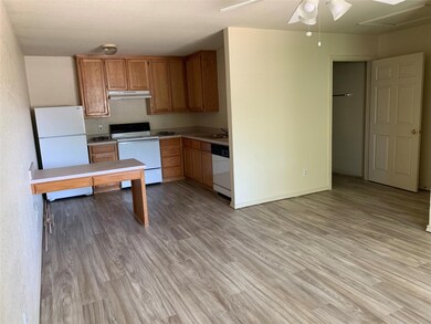 Kitchen featuring light wood-type flooring, white 