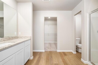 The ensuite bathroom is huge! Complete with a walk-in closet and glass, walk-in shower! You'll love getting ready in here every morning!