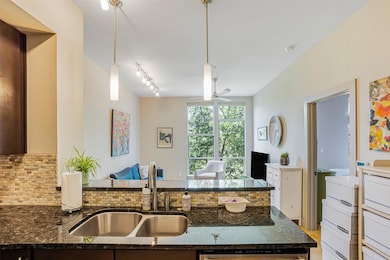 Kitchen featuring a sink, decorative backsplash, 
